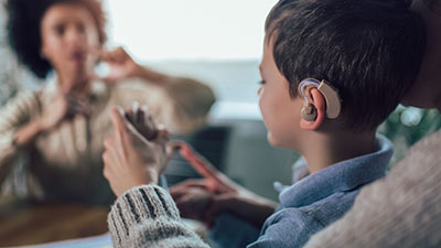child wearing a hearing aid