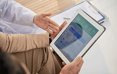 doctor showing patient results on an iPad